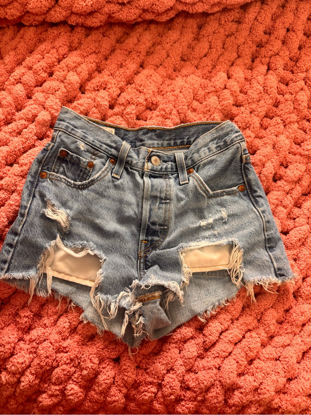 Levi's Distressed Cutoff Denim Shorts in Light Blue